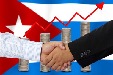 Arkaplan olarak Küba bayrağı ile el sıkışmak ya da sözleşmek.