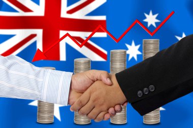 Arkaplan olarak Avustralya bayrağı ile el sıkışma veya sözleşme.