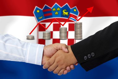 Arkaplan olarak Hırvatistan bayrağı üzerinde el sıkışma veya birlikte sözleşme.