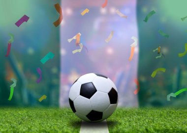 Nijerya bayrağı ve futbol topu. Spor kavramı.