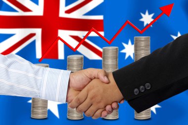 Arkaplan olarak Avustralya bayrağı ile el sıkışma veya sözleşme.