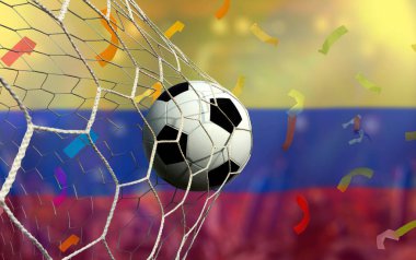 Kolombiya bayrağı ve futbol topu. Spor kavramı..