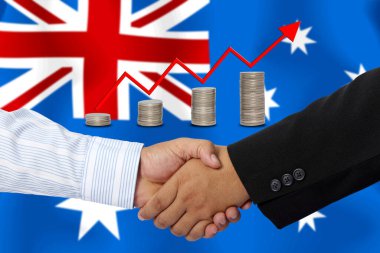 Arkaplan olarak Avustralya bayrağı ile el sıkışma veya sözleşme.