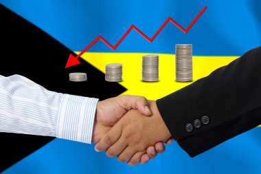 Arka plan olarak BAHAMA bayrağı ile el sıkışma veya sözleşme.