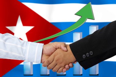 Arkaplan olarak Küba bayrağı ile el sıkışmak ya da sözleşmek.