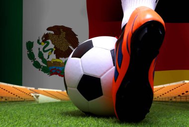 Futbol oyuncusunun bacakları ve ayakları kapalı yeşil çimlerde yürür ulusal Alman ve ulusal Meksika 'da maç yapmaya hazırdır..