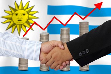Arka plan olarak URUGUAY bayrağı üzerinde el sıkışma veya birlikte sözleşme.