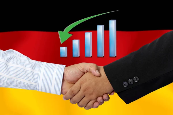 Handshake or contract together with on the flag of German as background.