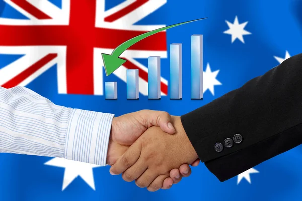 Arkaplan olarak Avustralya bayrağı ile el sıkışma veya sözleşme.