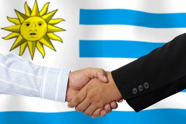 Apretón Manos Contrato Junto Con Bandera Uruguay Como Fondo —  Fotos de Stock