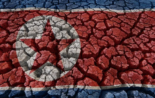 Flag of North Korea Flag on cracked earth background