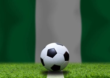 Nijerya bayrağı ve futbol topu. Spor kavramı.