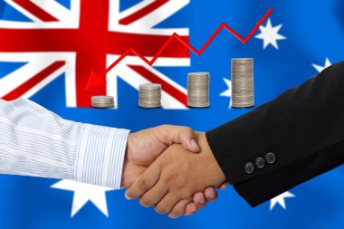 Arkaplan olarak Avustralya bayrağı ile el sıkışma veya sözleşme.