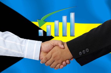 Arka plan olarak BAHAMA bayrağı ile el sıkışma veya sözleşme.