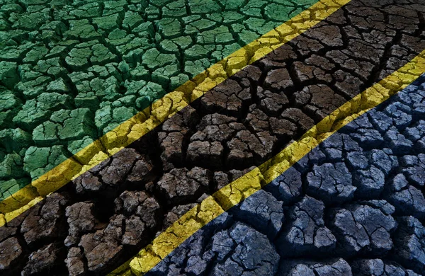 Çatlak Yeryüzü Arka Planında Tanzanya Bayrağı — Stok fotoğraf