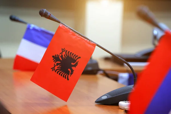 Important meeting of government in room with flags and blurred background