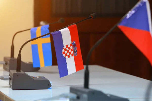 Important meeting of government in room with flags and blurred background