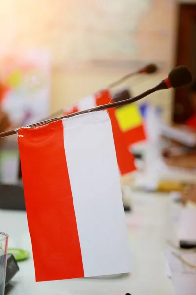 Important meeting of government in room with flags and blurred background