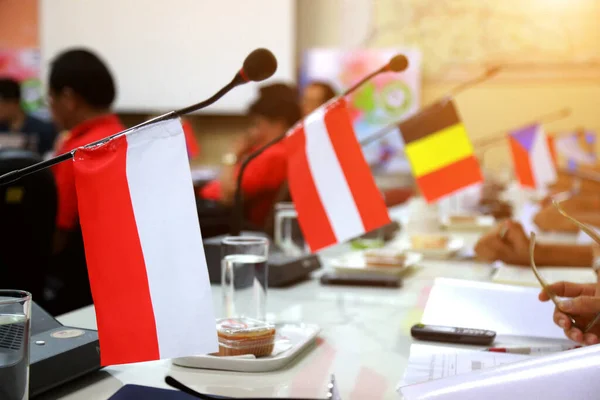 Important meeting of government in room with flags and blurred background