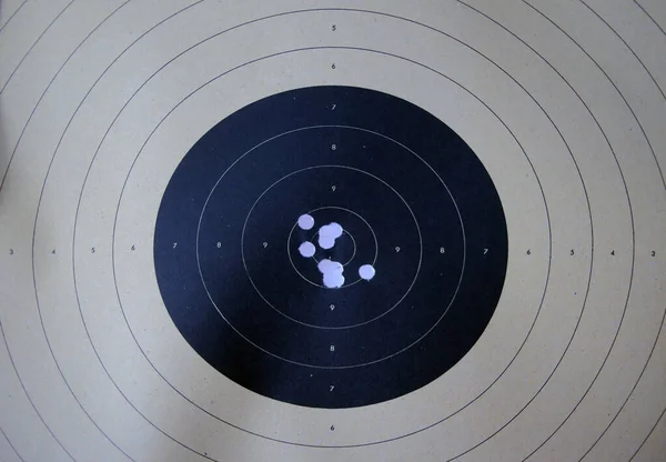 Bull eye target with bullet hole