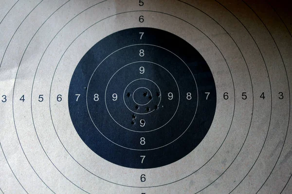 Bull eye target with bullet hole