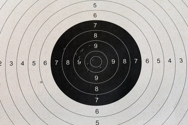 Bull eye target with bullet hole