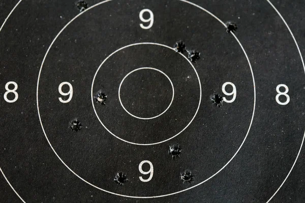 Bull eye target with bullet hole