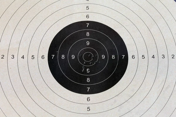 Bull eye target with bullet hole