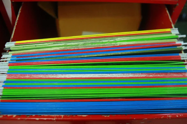 Paper documents stacked in archive