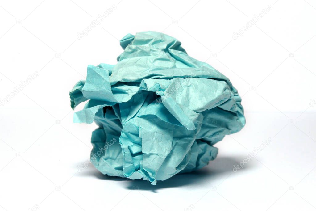 Close view of blank blue crumpled paper on white surface