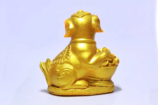 The chinese new year of the Dog. Gold Dog with money coins on white background. Symbol good Fortune for new year.