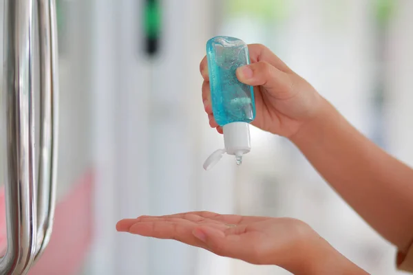 Woman Disinfecting Skin With Hand Sanitizer prevent infection, outbreak of Covid-19.