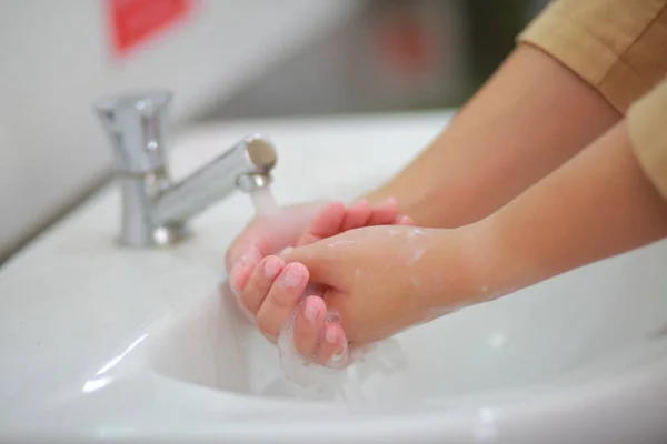 Wash hands with soap warm water and , rubbing nails and fingers washing frequently or using hand sanitizer gel prevent infection, outbreak of Covid-19.
