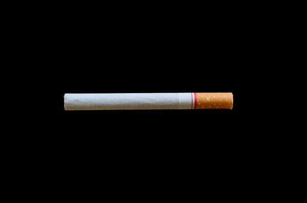 Cigarettes with a soft-focus background is dark. — Stock Photo, Image