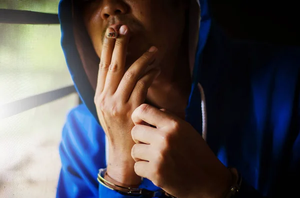 Dark Photo Man Handcuffs Blue Hoodie Smoking Wall Prisoner Smoking — Stock Photo, Image