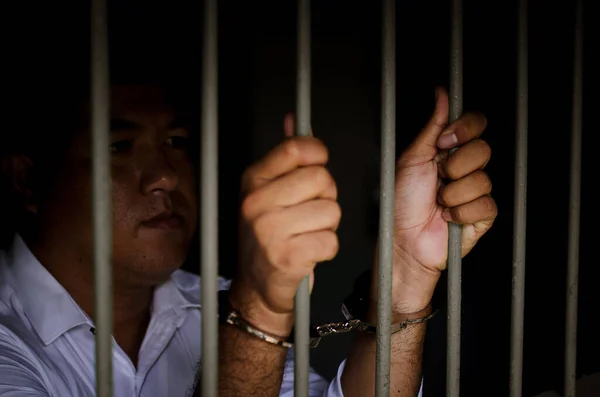 Closeup Iron Bars Handcuffed Hands Man White Shirt Detention Cell — Stock Photo, Image