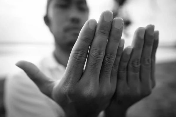 Muslim man praying close up