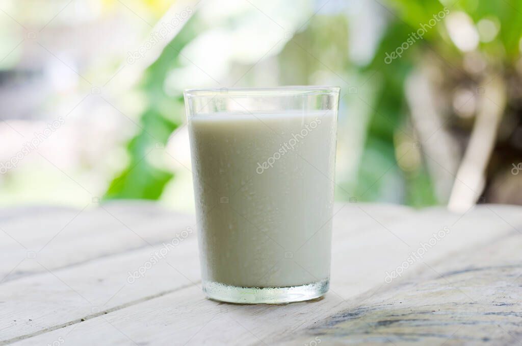 coffee and glass of milk on wooden table