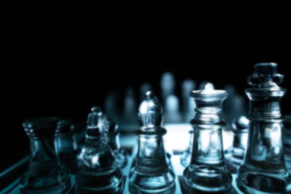 The concept of business competition: Close-up of glass chess