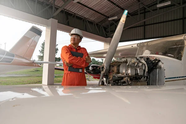 Asian male engineers were checking the availability of aircraft
