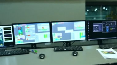 Male Asian engineers are operating in a system of radiation control