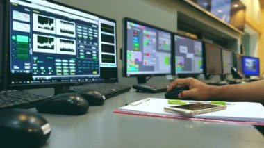 Male Asian engineers are operating in a system of radiation control