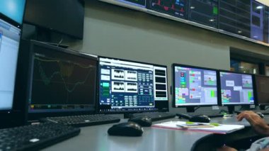 Male Asian engineers are operating in a system of radiation control