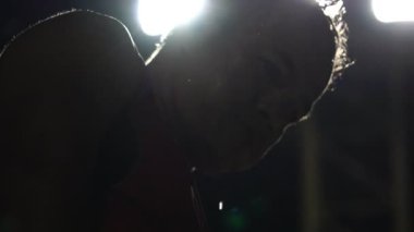 The runner was pouring water on his face, after a tired from running in the park footage slow motion