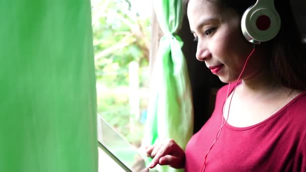Young Pregnant Woman Standing Window Using Digital Tablet Listening Music — Stock Video