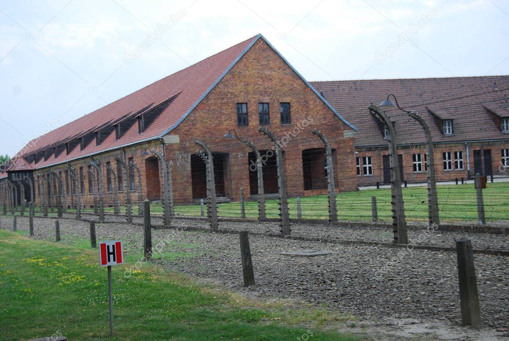 barracks and barbed wire fence. photo taken at the Auschwitz death camp. Poland