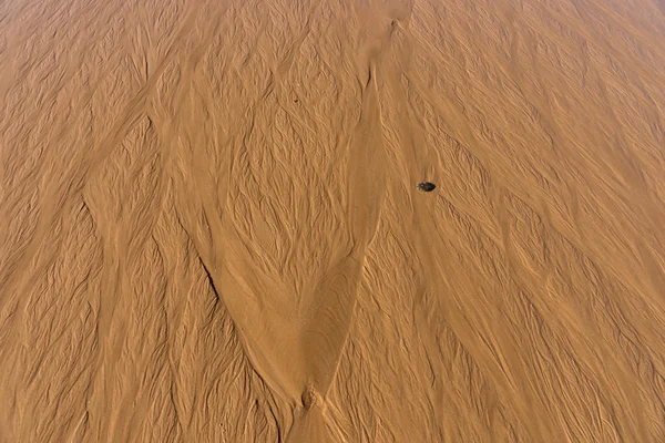 Marszczyć tekstury w piasku o zachodzie słońca — Zdjęcie stockowe