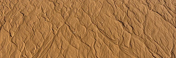 Texturas onduladas na areia ao pôr-do-sol — Fotografia de Stock