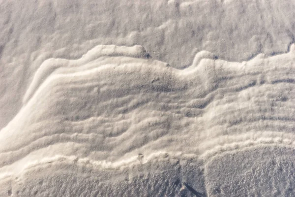 Primer plano de la textura de la superficie de nieve ventosa —  Fotos de Stock