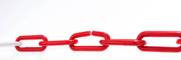 Red chain with broken element on white — Stock Photo, Image